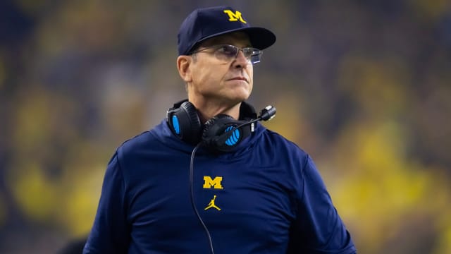 Michigan Wolverines head coach Jim Harbaugh looks on from the sideline against the Washington Huskies in the 2024 College Football Playoff national championship game.
